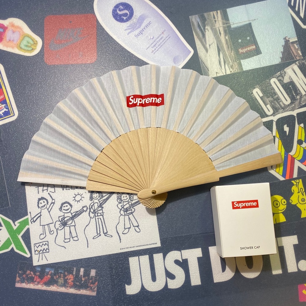 Supreme folding fan and a shower cap.
